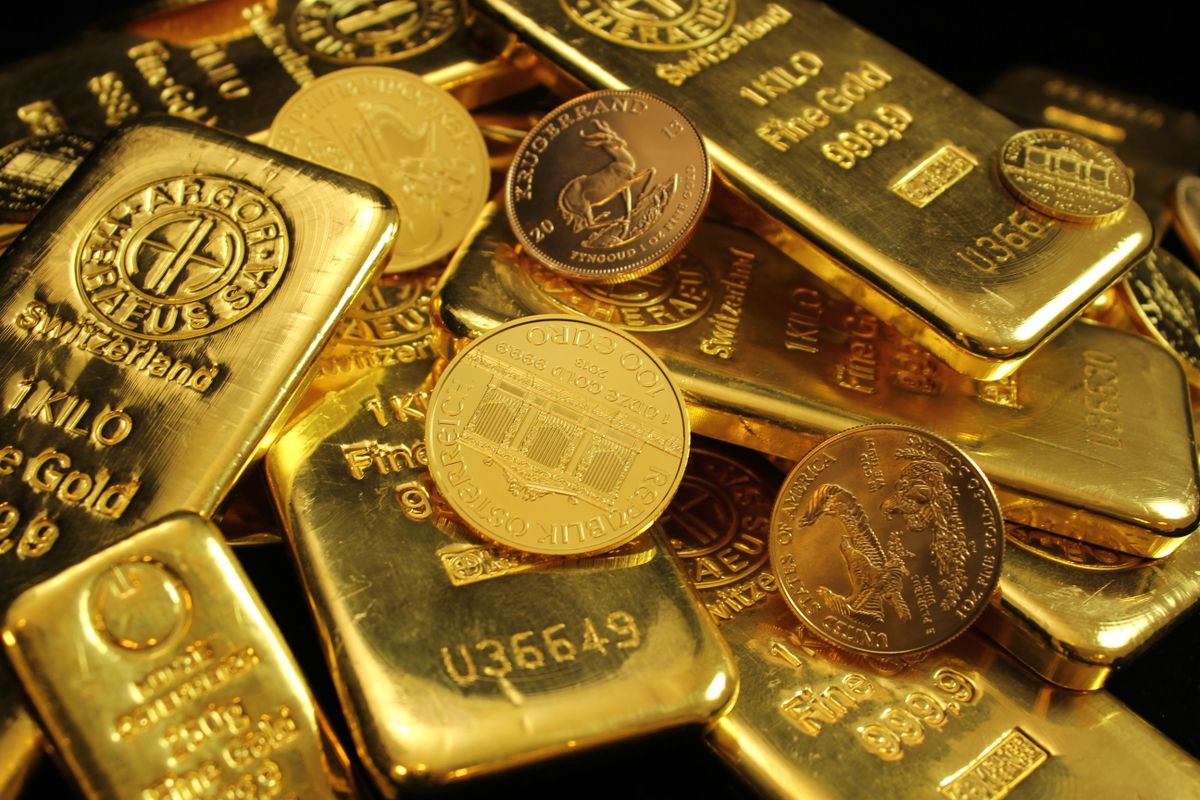 Gold bars and coins representing cash value for gold